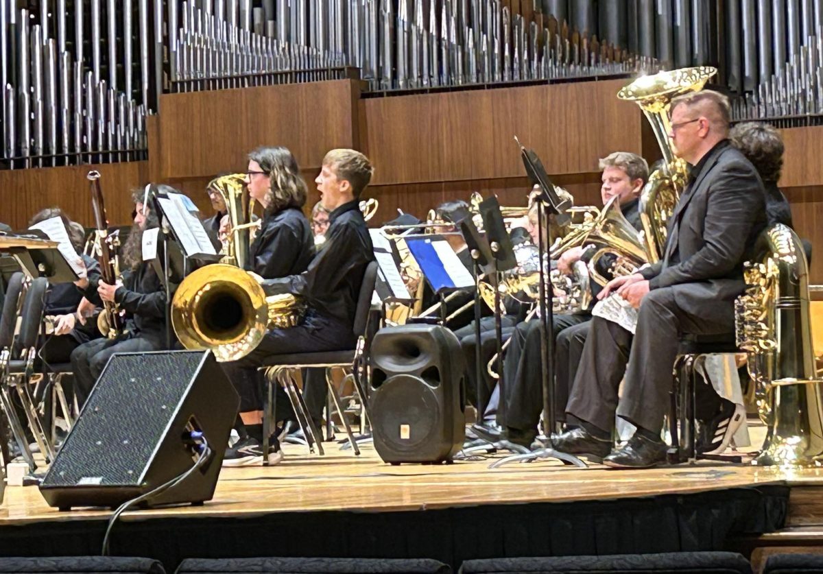 Members of the brass section prepare for their next piece during the Brass Day performance. Six works were performed throughout the concert.
