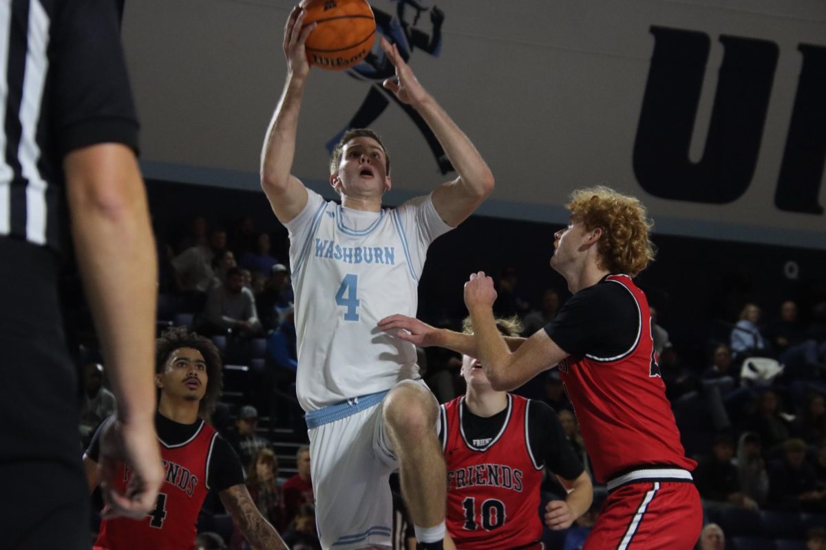 Sophomore forward Dillon Claussen leaps for a layup during the first half of the game. He finished with 19 points on 9-of-11 shooting to lead all scorers in the 105–51 win against the Falcons.
