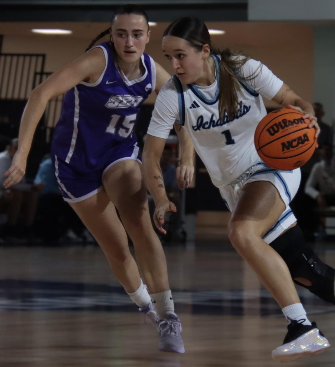 Gomez pushes past her guards. With 3rebounds and 6assists, Gomez had a strong teamwork game.
