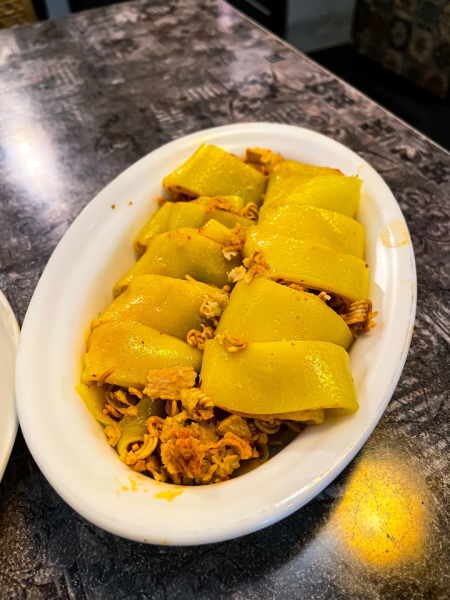 This plate of laphing, a traditional Tibetan dish, features the characteristic combination of spice, flavor and soft noodle texture. Originally known as a cool summer snack, it has become a year-round favorite among food lovers.
