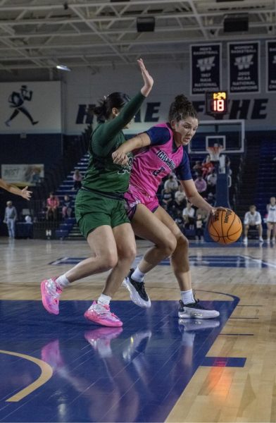 Junior forward Britany Kogbara dodges a RiverHawks defender. Kogbara demonstrated the Washburn women’s basketball team’s endurance and strength throughout the game.
