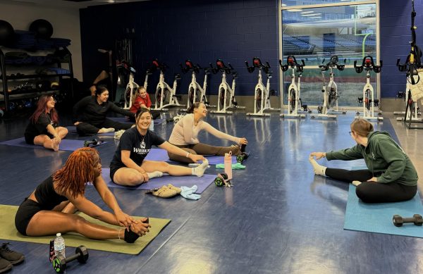 Students and sorority members gather at the Student Recreation and Wellness Center for the pilates event. Everyone followed the workout steps taught by Tyler Naquin, vice president of recruitment. 

