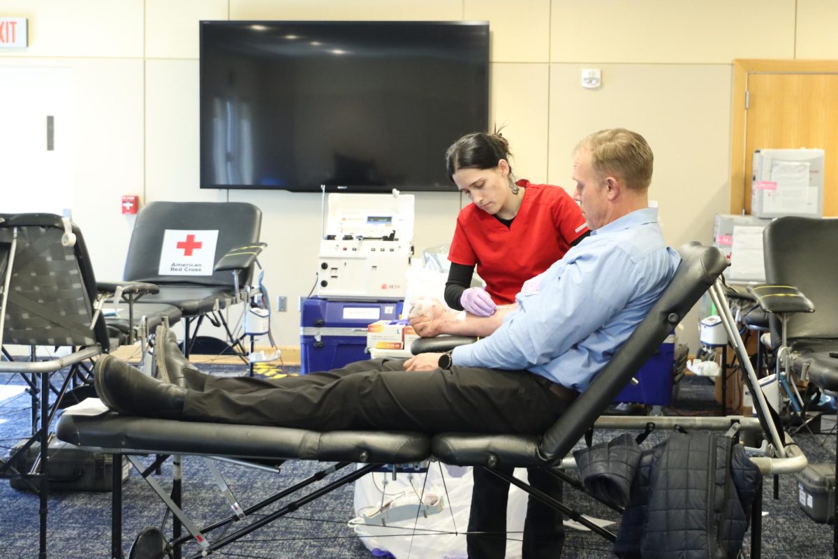 One of the Red Cross nurses help volunteers take their blood. The psychology club hosted the drive in Memorial Union. 

