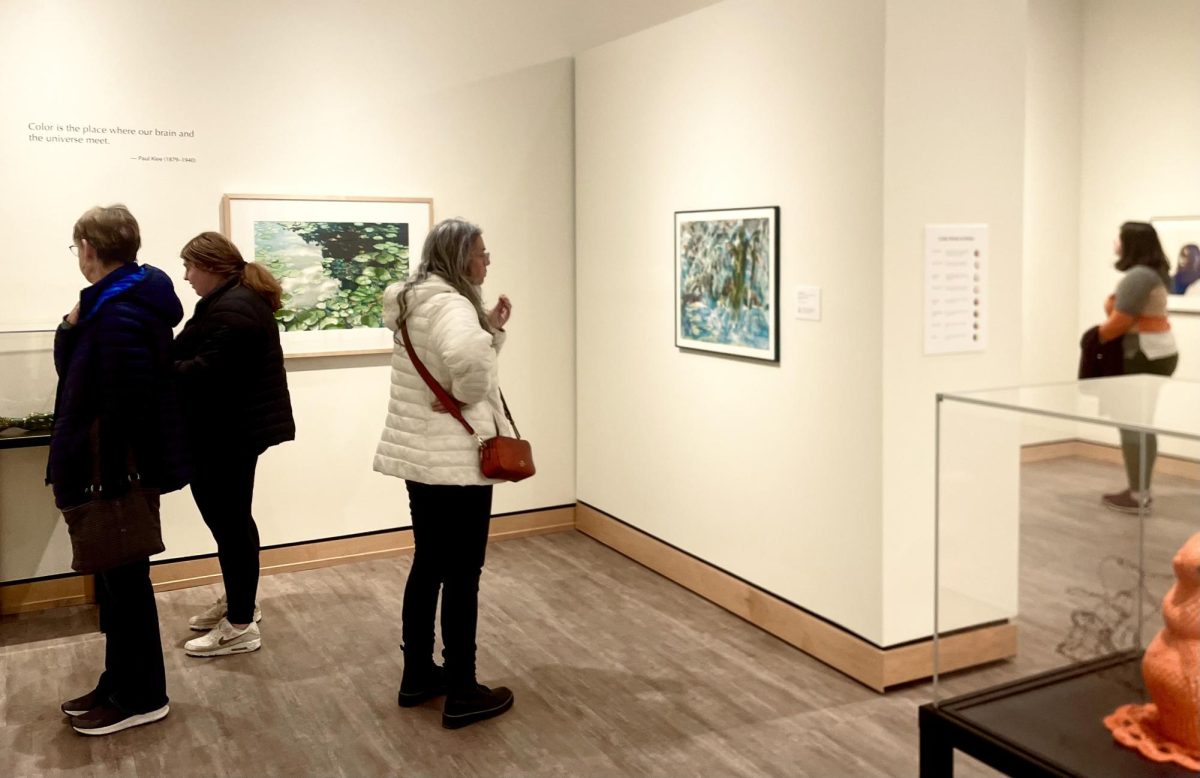 “The Relationships of Color: Exploring the Color Wheel” exhibition opened to the public. Guests moved through the collection, observing a variety of colors and images open to interpretation.
