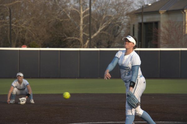 Senior pitcher Jenna Sprague delivers a pitch to her opponent. Sprague threw nearly six innings in the game, recording one strikeout.