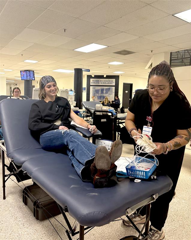 Jadyn Falley, senior biology major, donates blood during the Feb. 19 drive at Petro Allied Health Center. The event was organized by the Washburn Pre-Health Club in partnership with the Community Blood Center.