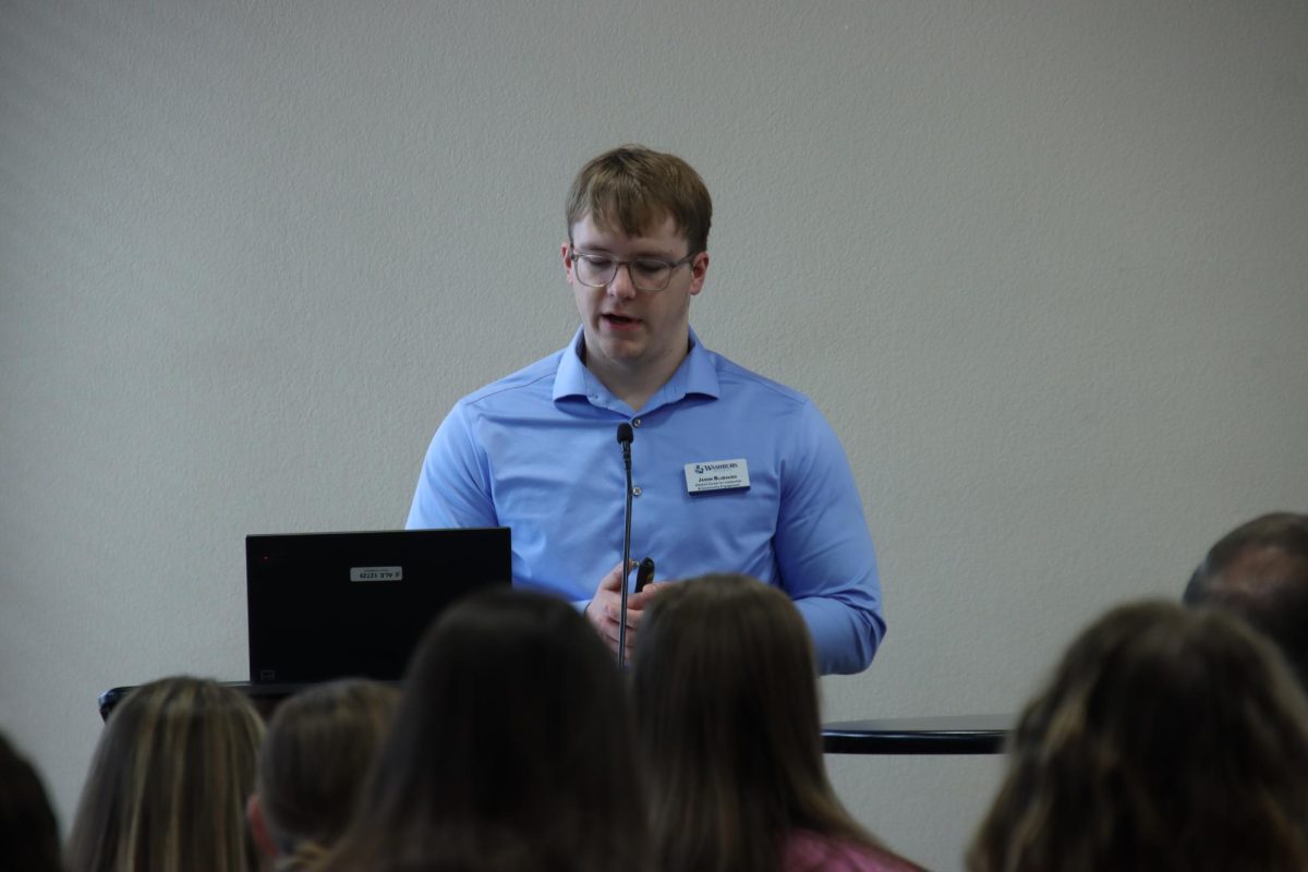 Jaxon Blubaugh, sophomore secondary history education major and Washburn leader challengement fellow, shares the agenda for the training. The Washburn Leadership Challenge has been an annual two-day competition that has brought together high school and college students from across the country to participate in a simulation.
