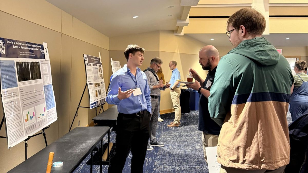 Clayton Wolfe, senior biology major, and his team present on the effects of native Kansas plants. Their objective was to assess the protective effects of four native Kansas plant extracts against osmotic stress.
