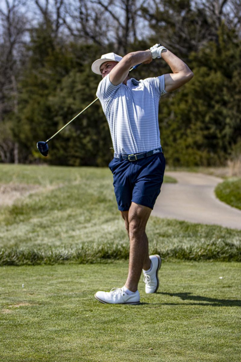 Redshirt Freshman, Brody Scafe, tees off the front 9 with a strong follow-through. With his powerful drive, he landed on the green, totaling his score to +1.

