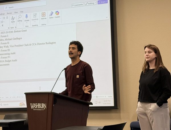 Michael Gallegos (left), president of the Washburn Student Bar Association, speaks about the organization’s accomplishments, including networking opportunities and alumni connections. Maureen Wetta(right), newly sworn in as president of the WSBA, shared plans to expand student engagement through office hours, social media updates and regular newsletters.