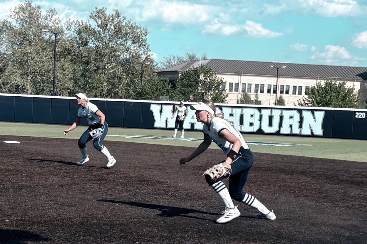 Washburn Ichabods softball infielders senior infield Kate Ediger (right) and sophomore infielder Dalaney Anderson (left) set for a defensive play at Gahnstrom Field. They later helped limit scoring in a 6-4 loss to the Missouri Western Griffons. 