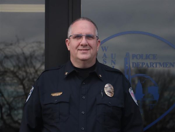Washburn Police Chief Chris Enos stands outside the Washburn University Police Department, where he has worked since 2005 and served as chief since 2016. Enos focuses on campus safety, student outreach and building trust between students and campus police.