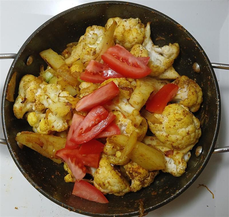 Turmeric, cilantro, cumin powder, chilli powder and salt are added. It was stirred well so that all the spices were evenly distributed.