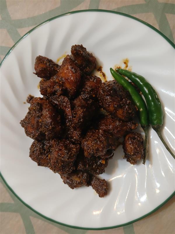 Chicken achar [pickle] is a popular Nepali dish served with rice and curry, especially during festive occasions. This dish can be saved for up to three months if stored in an airtight container. 
