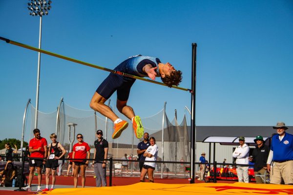 Freshman high jumper Slade Smith, glides over the bar. Smith placed fifth in the final men’s high jump rankings with a jump of 6 feet 8.25 inches.