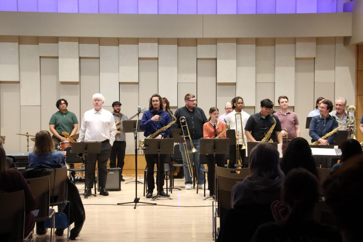 All the performers stand during the final part of the concert to thank the audience for attending. At the end of the concert, the audience applauds loudly to praise the performance.