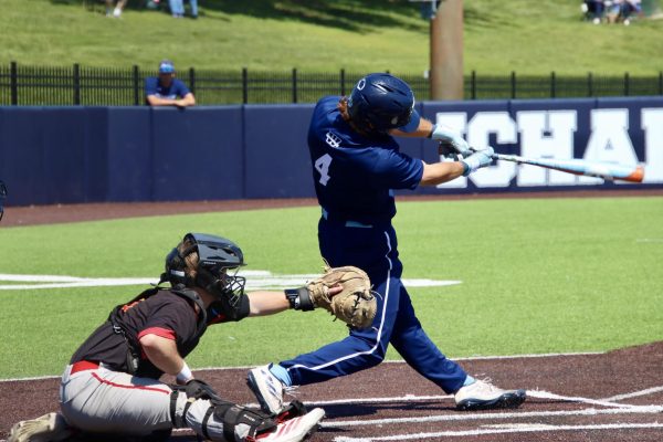 Junior utility Trento Barry swings the bat and hits the ball. Barry went 2-for-3, meaning he got 2 hits in 3 at-bats, including a double and drove in 2 runs.